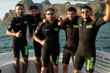Scuba diving students practising regulator use in a shallow training pool