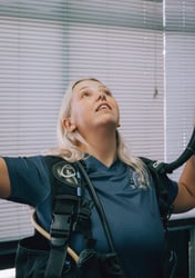 Scuba instructor demonstrating buoyancy control techniques during a classroom briefing
